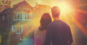 Couple stood in front of a new home