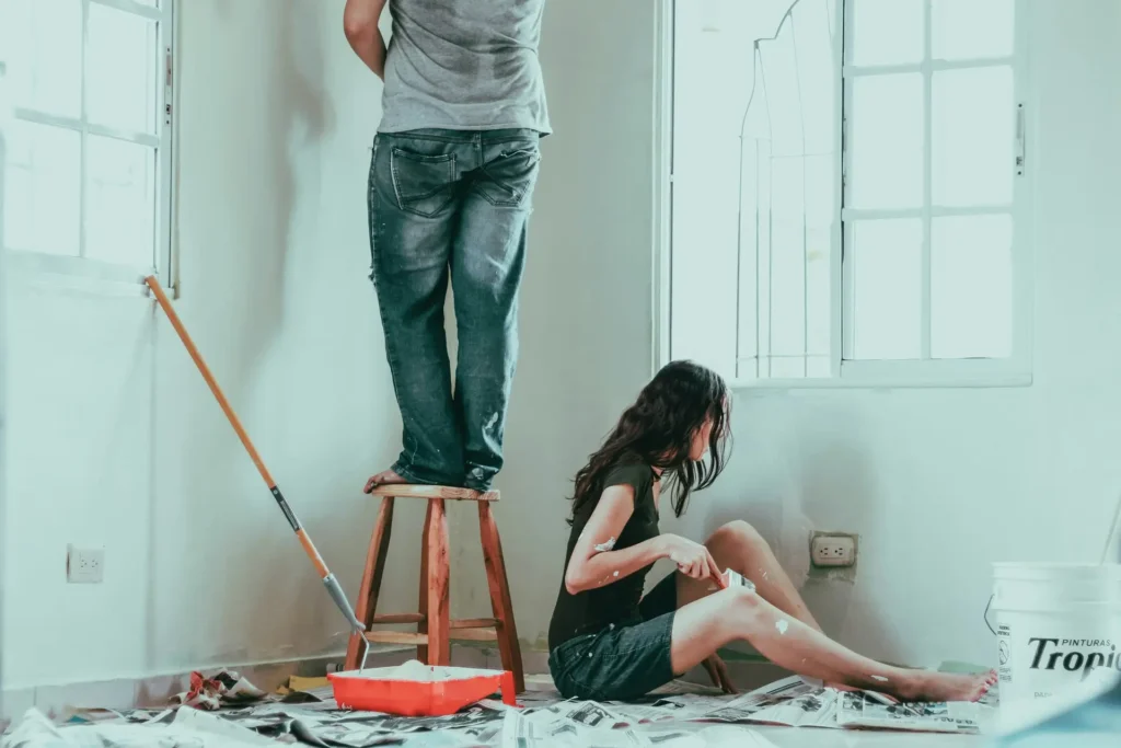 Couple Painting a New Home